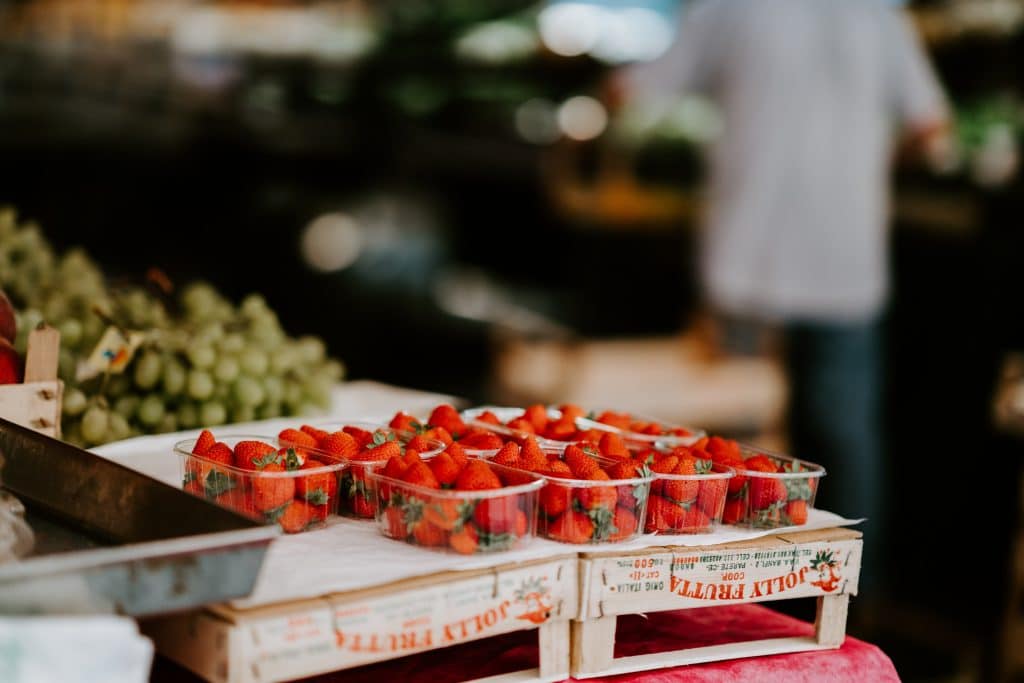 Table with punnets of strawberries